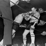 Louis Richards (right) during his final bout of the night. His opponent (centre) is  Louie Torrao